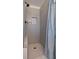 Modern tiled shower with rain shower head, built-in niche and glass enclosure at 923 Wexford Way, Auburn, GA 30011