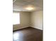 Bedroom with hardwood floors, neutral walls, and a window for natural light at 1630 Stonehaven, Cumming, GA 30040