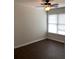 Neutral bedroom with hardwood floors and a large bright window at 1630 Stonehaven, Cumming, GA 30040