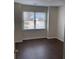 Neutral bedroom with hardwood floors and a large bright window at 1630 Stonehaven, Cumming, GA 30040