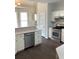 Kitchen area with stainless steel appliances and a breakfast bar at 1630 Stonehaven, Cumming, GA 30040