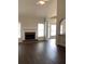 Bright living room featuring a fireplace, wood floors, and lots of natural light at 1630 Stonehaven, Cumming, GA 30040