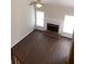 Sunlit living room with cozy fireplace and neutral decor at 1630 Stonehaven, Cumming, GA 30040