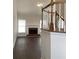 Cozy living room with a brick fireplace and wood floors at 1630 Stonehaven, Cumming, GA 30040