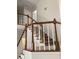 Staircase with carpeted steps, white risers, and wood railing at 1630 Stonehaven, Cumming, GA 30040