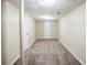 Finished basement with neutral carpeting and white painted doors at 1826 Meadowglades Dr, Decatur, GA 30035