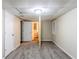 Spacious basement area with neutral walls, gray carpeting, and views into an additional unfinished room at 1826 Meadowglades Dr, Decatur, GA 30035