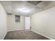 A well-lit basement bedroom with neutral walls, carpeting, and a window for natural light at 1826 Meadowglades Dr, Decatur, GA 30035