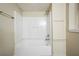 This bathroom features a shower-tub combination with built in storage shelves at 1826 Meadowglades Dr, Decatur, GA 30035