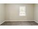 Bedroom featuring neutral colored walls, large window, and neutral carpeting at 1826 Meadowglades Dr, Decatur, GA 30035