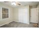 Bedroom featuring standard closet, ceiling fan, and lots of natural light at 1826 Meadowglades Dr, Decatur, GA 30035