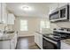 Kitchen with granite countertops, stainless steel appliances, and natural light at 1826 Meadowglades Dr, Decatur, GA 30035