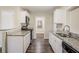 Bright kitchen with white cabinets, granite countertops, and stainless steel appliances at 1826 Meadowglades Dr, Decatur, GA 30035