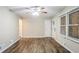 Bright living room with modern wood floors, ceiling fan, and window blinds at 1826 Meadowglades Dr, Decatur, GA 30035