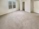 Spacious carpeted bedroom with natural light at 1997 Alcovy Trace Way, Lawrenceville, GA 30045