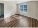 Sunlit bedroom showcasing wood flooring and a window with natural light at 1997 Alcovy Trace Way, Lawrenceville, GA 30045