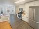 Charming kitchen with white cabinets, stainless steel appliances, butcher block countertops and a farmhouse sink at 1997 Alcovy Trace Way, Lawrenceville, GA 30045