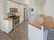 Well-equipped kitchen featuring stainless steel appliances, wooden countertops, and white cabinetry at 1997 Alcovy Trace Way, Lawrenceville, GA 30045