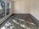 Living room featuring laminate flooring and large windows at 1997 Alcovy Trace Way, Lawrenceville, GA 30045