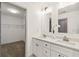 Bright bathroom featuring double sink vanity with quartz counters, and walk-in closet at 2206 Loring Ct, Decatur, GA 30032