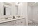 Bathroom featuring double sink vanity with stone countertop and subway tile shower and stylish tile flooring at 2206 Loring Ct, Decatur, GA 30032