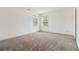 Bedroom featuring carpet flooring, neutral walls, and large windows to let in natural light at 2206 Loring Ct, Decatur, GA 30032