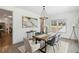 Bright dining room featuring modern decor, a stylish chandelier, and a large window offering natural light at 2206 Loring Ct, Decatur, GA 30032