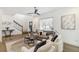 Inviting living room showcasing hardwood floors, modern decor, and a comfortable seating arrangement under a ceiling fan at 2206 Loring Ct, Decatur, GA 30032