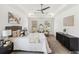 Comfortable main bedroom with a tray ceiling, neutral decor, and modern furnishings at 2206 Loring Ct, Decatur, GA 30032