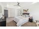 Comfortable main bedroom with a tray ceiling, neutral decor, modern furnishings, and ensuite bathroom at 2206 Loring Ct, Decatur, GA 30032