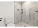 Modern tiled shower with frameless glass door and built-in niche at 2206 Loring Ct, Decatur, GA 30032