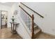 View of the home's staircase and nearby powder room, featuring hardwood and carpeted steps at 2206 Loring Ct, Decatur, GA 30032