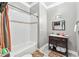 Bathroom with white subway tile in the shower/tub and an espresso vanity with an off-white countertop at 1030 Chateau Forest Rd, Hoschton, GA 30548