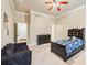 Bright bedroom featuring carpeted floors, crown molding, and comfortable furniture at 1030 Chateau Forest Rd, Hoschton, GA 30548