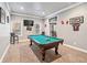 Basement billiards room featuring a classic pool table and ample seating at 1030 Chateau Forest Rd, Hoschton, GA 30548