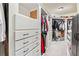 Large walk-in closet features custom storage, shelving, drawers and plenty of room at 1030 Chateau Forest Rd, Hoschton, GA 30548