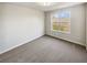 Bedroom featuring a window with natural light, neutral colored walls, and carpet at 122 Sanders Walk, Mcdonough, GA 30252