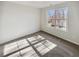 Bedroom featuring a window with natural light, neutral colored walls, and carpet at 122 Sanders Walk, Mcdonough, GA 30252