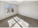 Bedroom featuring a large window, neutral colored walls, and carpet at 122 Sanders Walk, Mcdonough, GA 30252