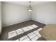 Carpeted dining room filled with light and featuring a modern light fixture at 122 Sanders Walk, Mcdonough, GA 30252