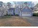 Charming blue two-story home with attached two-car garage and well-maintained landscaping at 2910 Mitchell Ne Cv, Brookhaven, GA 30319