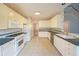 Eat-in kitchen features bright white cabinets, tiled floors and a breakfast nook at 2910 Mitchell Ne Cv, Brookhaven, GA 30319