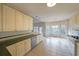 Bright kitchen with white cabinets, stainless steel appliances, large windows, and tile flooring at 2910 Mitchell Ne Cv, Brookhaven, GA 30319