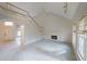 Open living room showcasing a fireplace and the second story staircase and balcony at 2910 Mitchell Ne Cv, Brookhaven, GA 30319