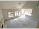 Bright living room featuring a fireplace, large windows and an adjacent dining area at 2910 Mitchell Ne Cv, Brookhaven, GA 30319