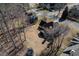 Aerial view of home featuring a large backyard with mature trees and outdoor recreation equipment at 685 Trailwood Sw Ln, Marietta, GA 30064