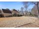 Spacious backyard with a screened in porch and mature trees at 685 Trailwood Sw Ln, Marietta, GA 30064