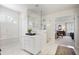 Bright bathroom with a glass-enclosed shower featuring subway tile and marble flooring at 685 Trailwood Sw Ln, Marietta, GA 30064