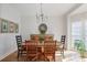 Elegant dining room featuring a wooden table, stylish chandelier, and lots of natural light at 685 Trailwood Sw Ln, Marietta, GA 30064