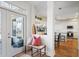 Inviting entryway with a view into the kitchen, featuring hardwood floors and natural light at 685 Trailwood Sw Ln, Marietta, GA 30064